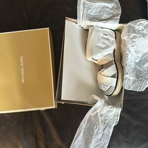 Brand new. Michael Kors Darby Sandals size 8